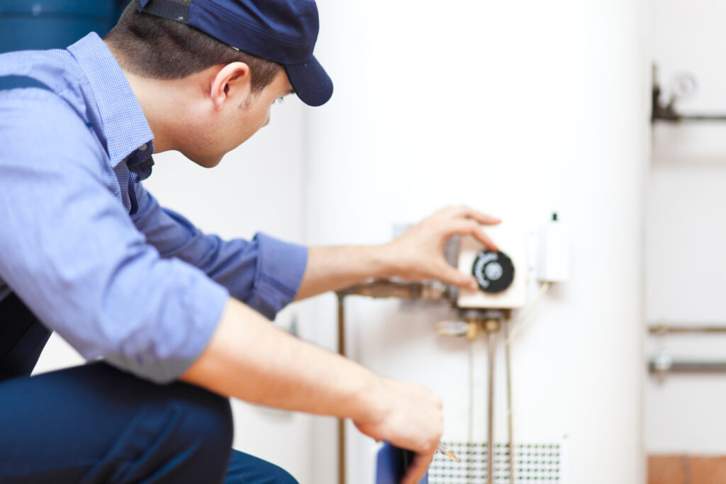 Technician repairing an hot water heater